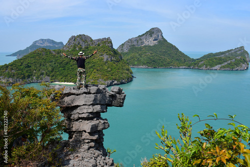 Asian tourists standing on top of a limestone mountain in Ang Thong Marine National Park
