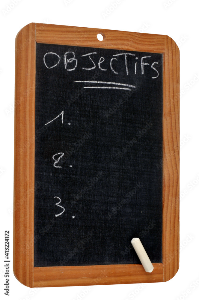 Objectifs écrit sur une ardoise d'école avec une craie Objectifs écrit sur une ardoise d'école avec une craie