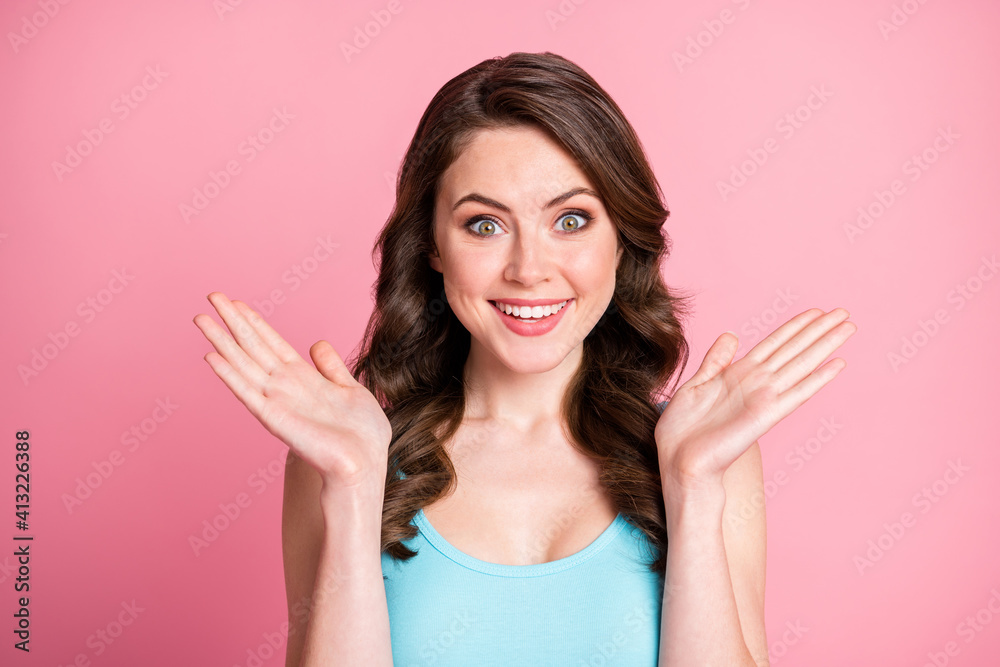 Close up portrait of delighted person arms palm up impressed face blue tank-top isolated on pastel pink color background Close up portrait of delighted person arms palm up impressed face blue tank-top isolated on pastel pink color background