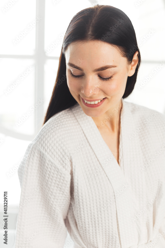 Beauty woman clean healthy skin, natural make-up spa cosmetology concept long dark hair. Woman in white bathrobe Beauty woman clean healthy skin, natural make-up spa cosmetology concept long dark hair. Woman in white bathrobe