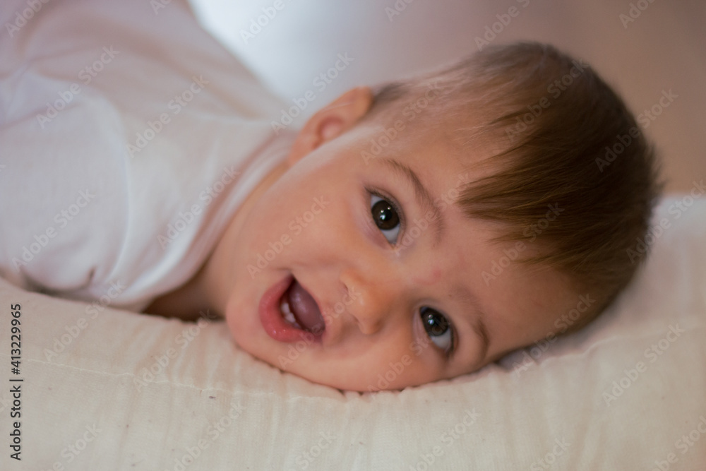 portrait of a smiling baby looking straight at the camera portrait of a smiling baby looking straight at the camera