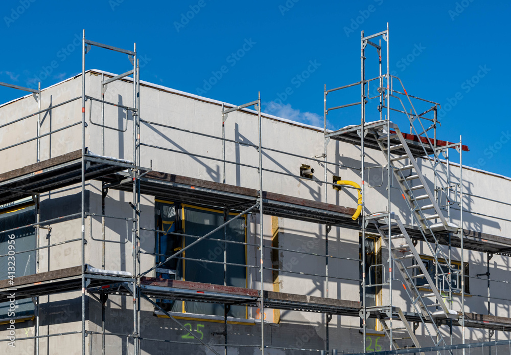 building under construction, scaffolding at the facade building under construction, scaffolding at the facade