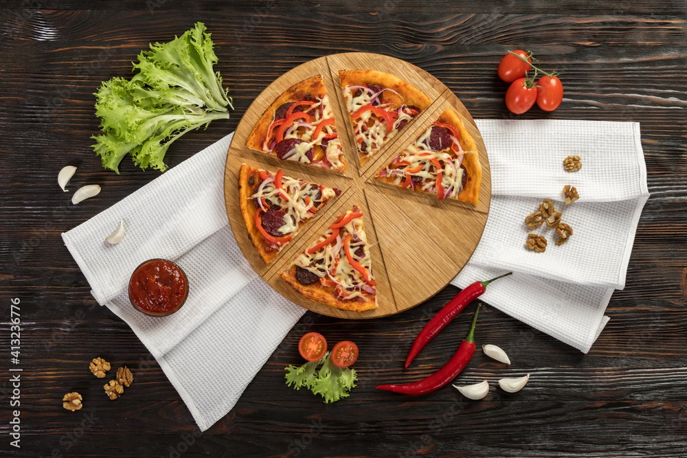 Delicious pizza on a wooden cutting board