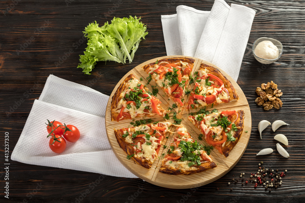 Delicious pizza on a wooden cutting board
