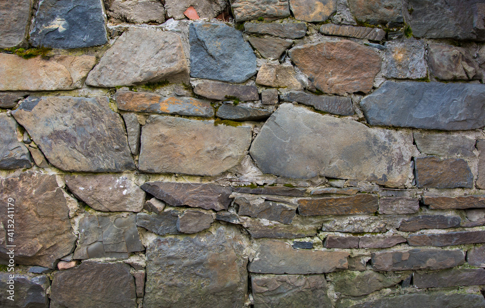 Castle wall made of old stones textures for design and photo background. Castle wall made of old stones textures for design and photo background.
