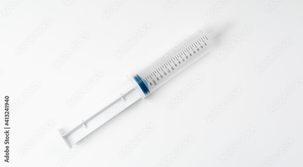 Large open syringe on white background. Syringe with scale. Vaccine and medicine concept. Large open syringe on white background. Syringe with scale. Vaccine and medicine concept.