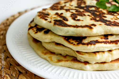 Homemade wheat cakes with cheese filling, close-up. Filled flat bread