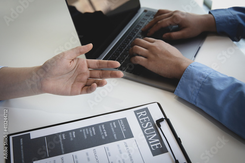 Wallpaper Mural Employer or HR leader is interviewing participants, applying for a company employee, and having read the proficiency test resume to recruit qualified employees, Selection of job applicants. Torontodigital.ca