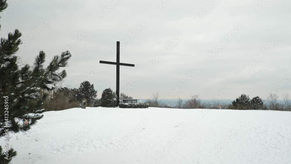 [4k] christian cross ontop of snowy mountain at halde haniel