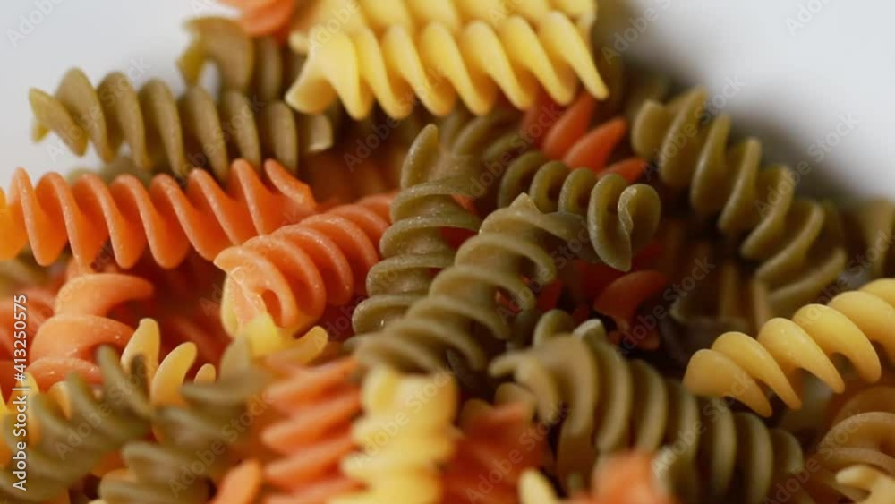 colored fresh raw pasta close up slow motion