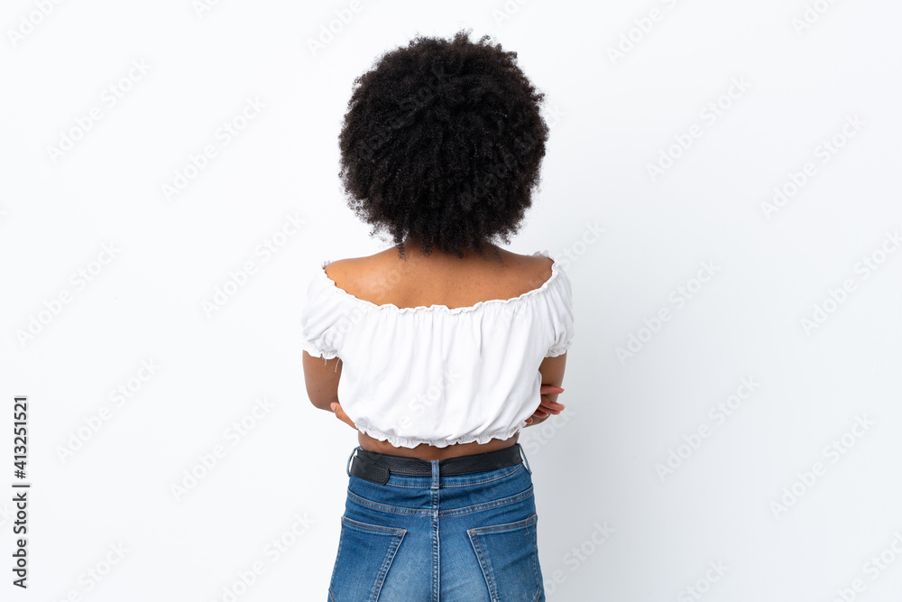 Young African American woman isolated on white background in back position Young African American woman isolated on white background in back position