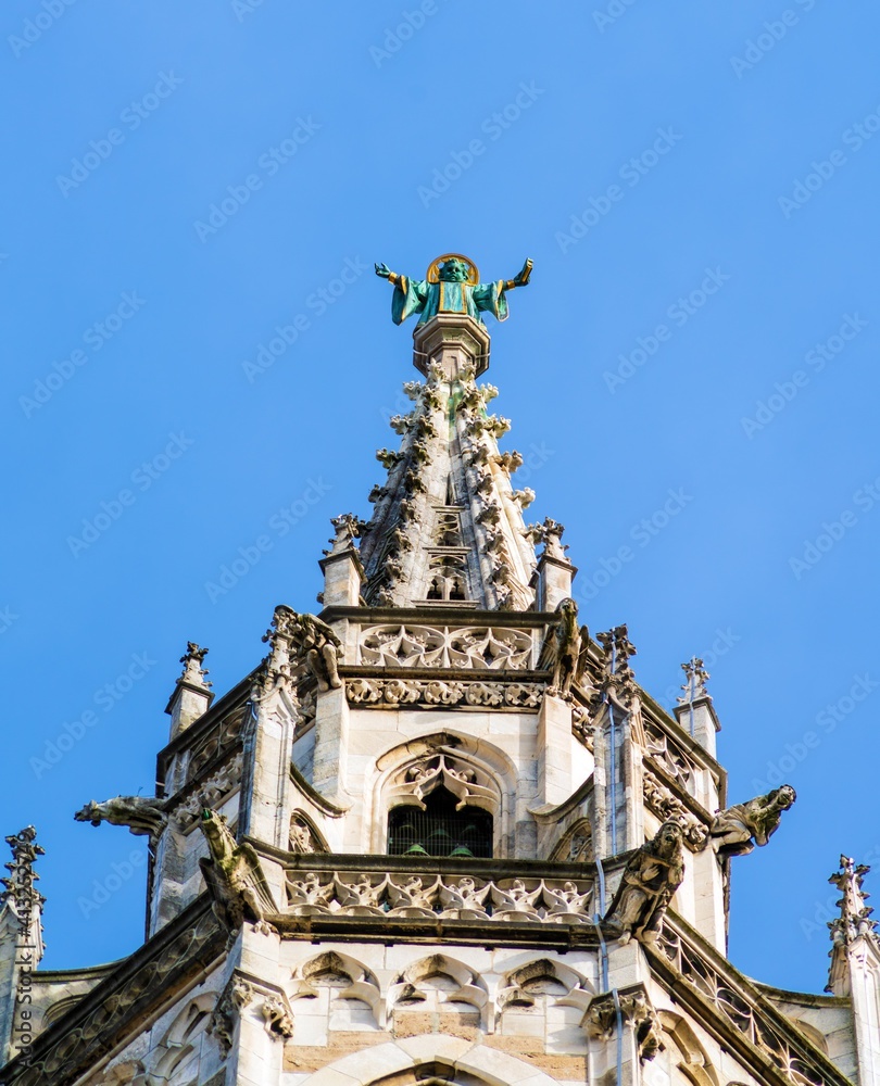 Statue of monk on top of Rathaus, symbol of city, Munich, Germany