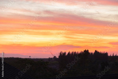 Morning blur over mountains and trees. The first and last light of the day in sky with beautiful