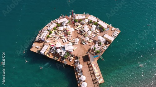 Exclusive relaxation on the luxury hotel pier in the Mediterranean. A wonderful vacation with your best friends with party and club entertainment