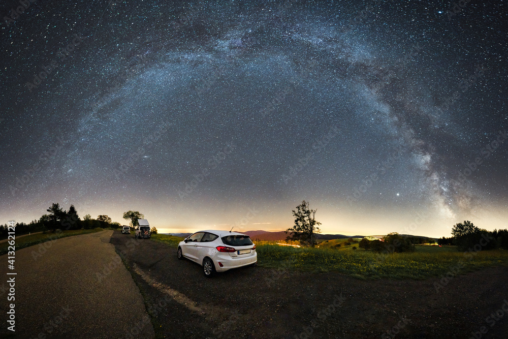 car in front of the milky way panorama shot on the schauinsland near freiburg - obrazy, fototapety, plakaty 