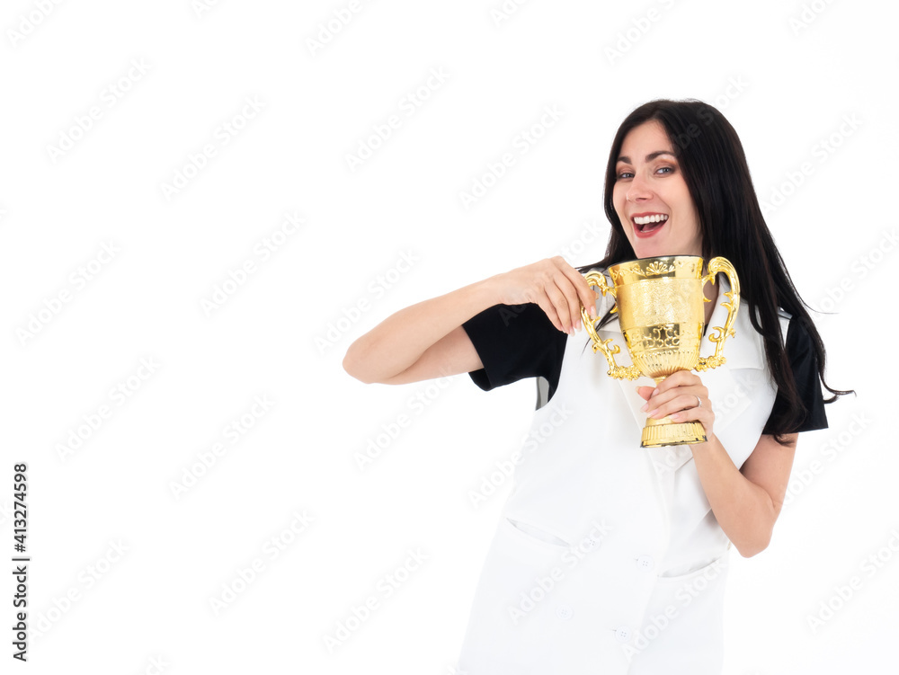 Caucasian pretty girl laugh smile and hold shiny gold trophy cup which prize from excellent leadership working in the company office isolated on white background Caucasian pretty girl laugh smile and hold shiny gold trophy cup which prize from excellent leadership working in the company office isolated on white background