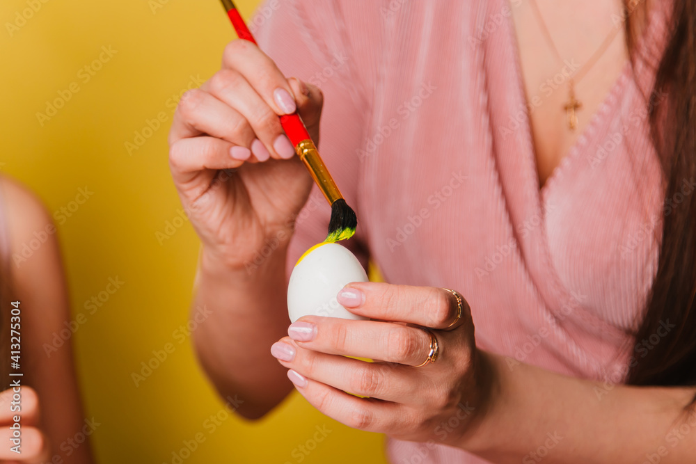 Easter eggs are painted close-up. A believing Christian family getting ready for the holiday. Easter eggs are painted close-up. A believing Christian family getting ready for the holiday.