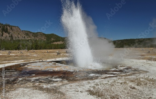 Jewel Geyser erupting along Biscuit Basin Loop Trail  Continental Divide Trail  in Biscuit Basin at Yellowstone National Park  Wyoming