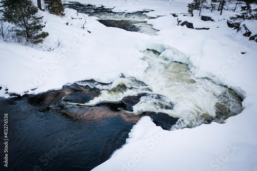 River aerial view of winter flowing waters