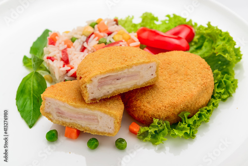 Chicken meatballs in batter with ham and risotto