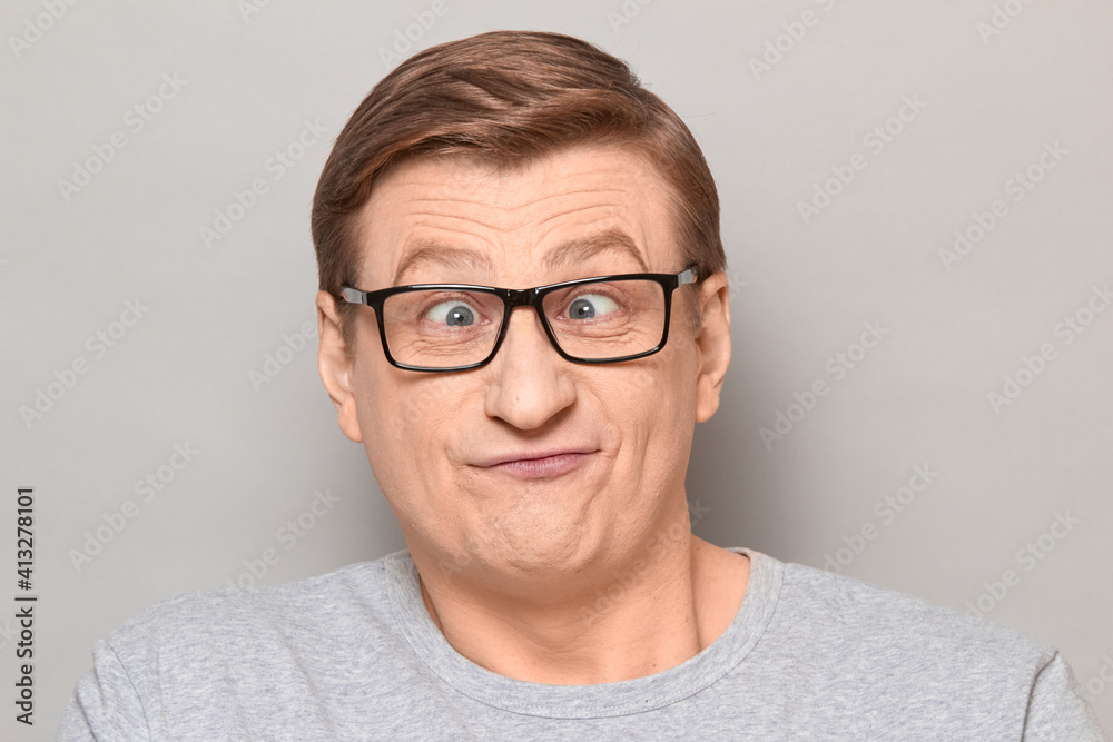 Portrait of funny man fooling around and making goofy silly face