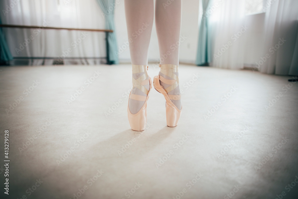 Close up of ballerina legs on pointe shoes Close up of ballerina legs on pointe shoes