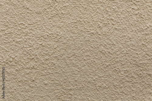 Beige painted stucco wall. Background texture.