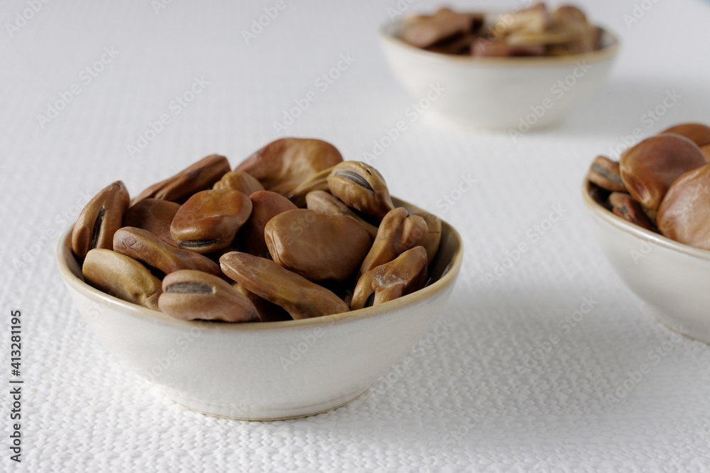 Dried fava beans (Vicia faba) close-up. Vegan protein food. Dried fava beans (Vicia faba) close-up. Vegan protein food.