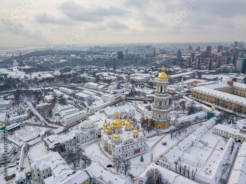 Kiev Pechersk Lavra, covered with snow. Cloudy winter morning. Aerial drone view.