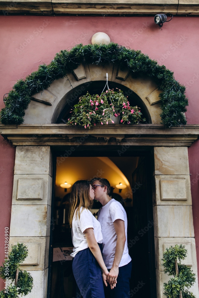 Walk of a loving couple through the city and the park. Young people travel to Europe. Walk of a loving couple through the city and the park. Young people travel to Europe.