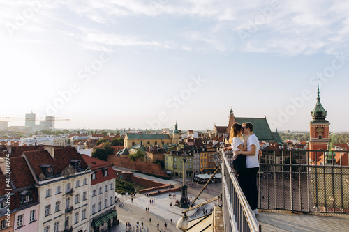 A young couple travels around the European capital. Panorama of the old city.