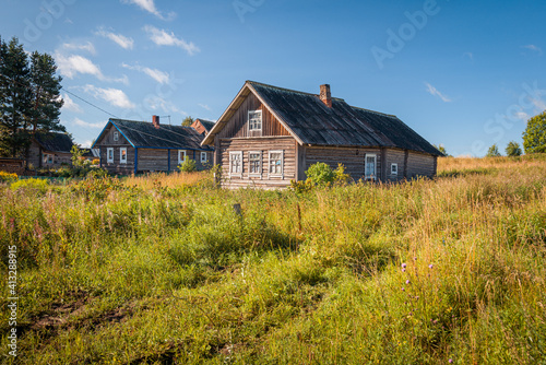An old abandoned house in Karelian village in Russia on a sunny summer day