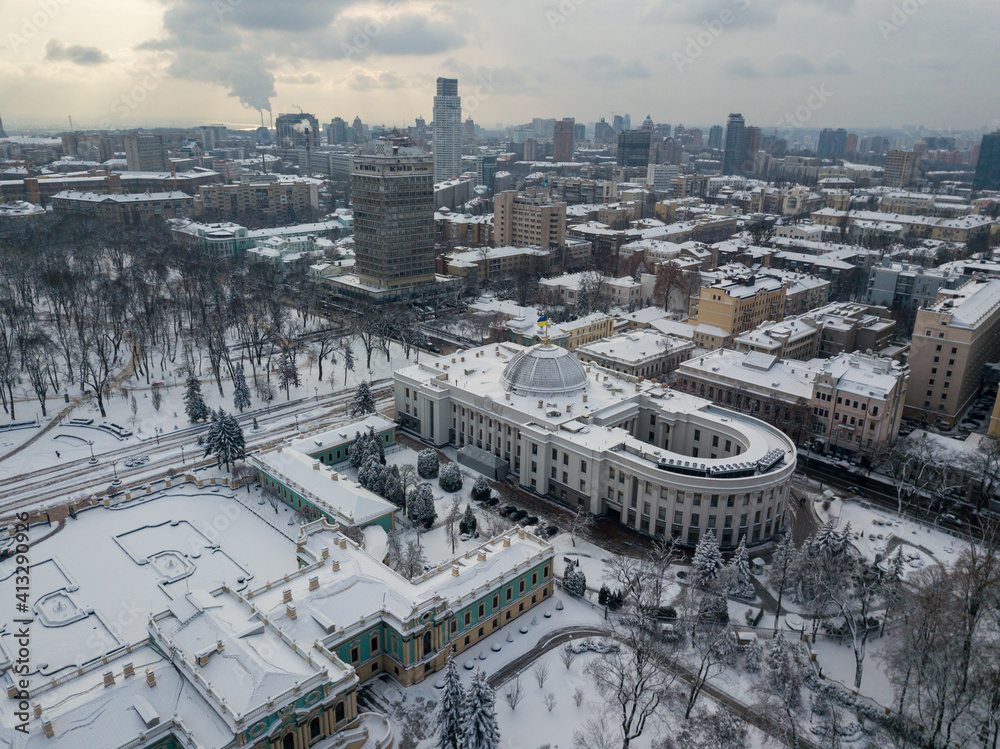 Snow-covered Mariinsky palace in Kiev. Aerial drone view. Winter snowy morning.