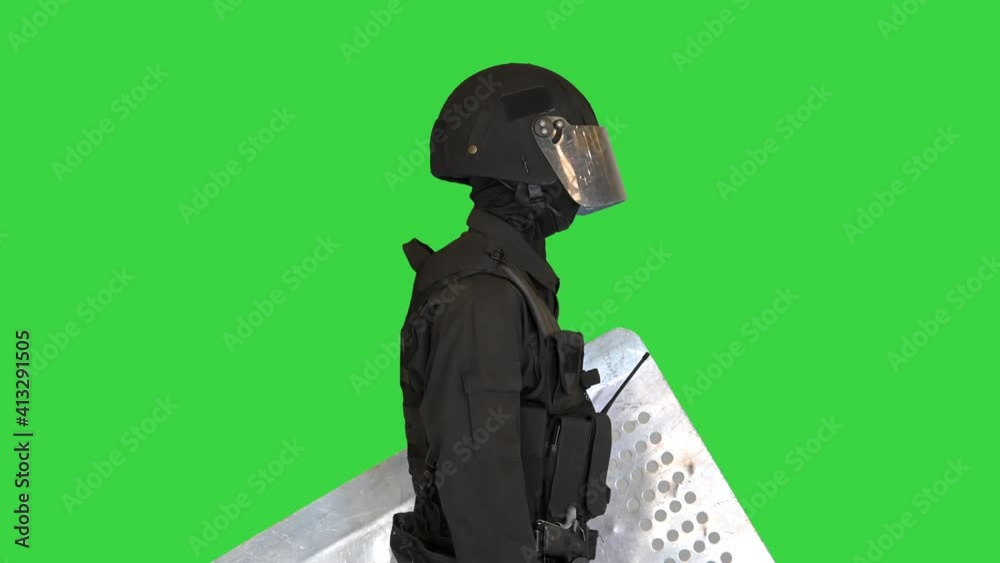 Riot police special forces unit standing with the shield down on a ...