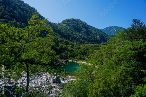 Natural pool in the Maggia river with turqouise water