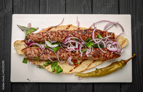 Georgian cuisine - lulia kebab, with grilled onions, traditional Georgian cuisine photo