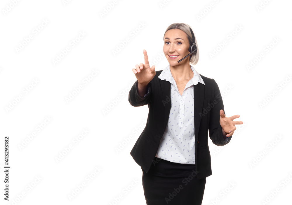 Business speaker. Attractive adult caucasian woman in formal wear with headset and microphone does show to the audience and expressive gesturing, isolated on white. Business speaker. Attractive adult caucasian woman in formal wear with headset and microphone does show to the audience and expressive gesturing, isolated on white.