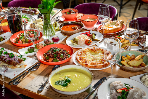 Georgian cuisine. A large laid table of different dishes