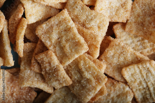 Cinnamon sugar cereal dry close up for breakfast food.