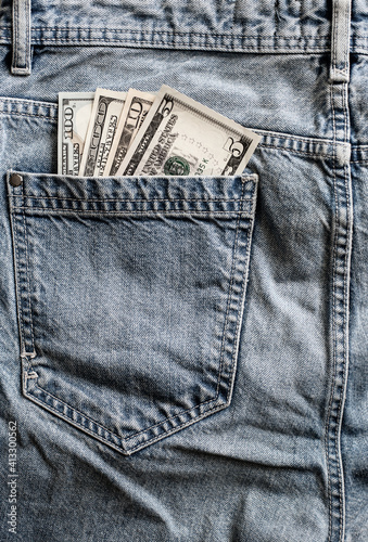 dollars in jeans pocket