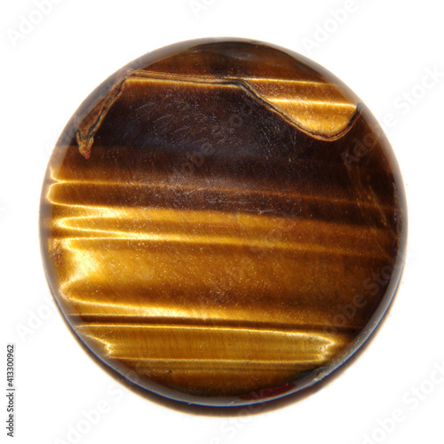 Tiger eye round cabochon on white background 