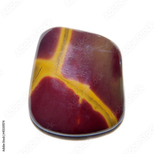 Natural mookaite cabochon on white background