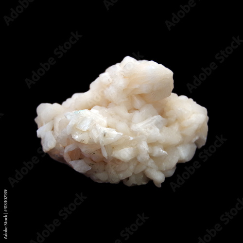 Natural crude stilbite stone on black background  