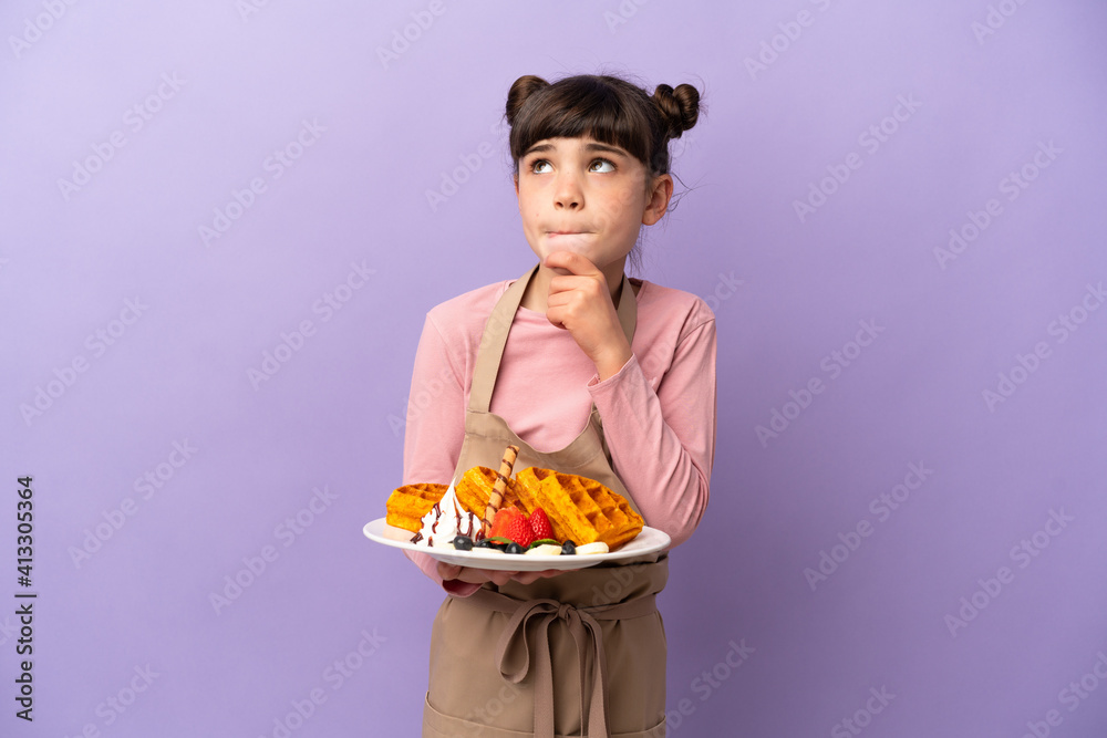 Little caucasian girl holding waffles isolated on purple background having doubts and thinking Little caucasian girl holding waffles isolated on purple background having doubts and thinking