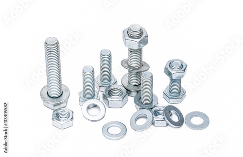 Steel bolts with nuts and washers on a white background