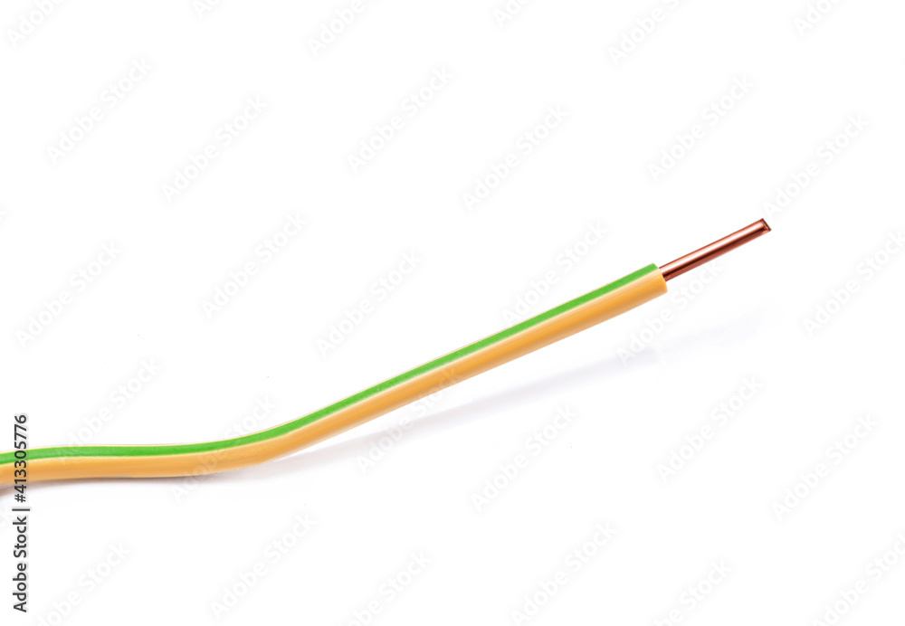 Copper wire with yellow and green markings on a white background Copper wire with yellow and green markings on a white background