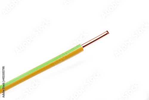 Copper wire with yellow and green markings on a white background