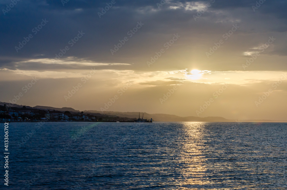 Sunset over the coastal, tourist, place Pefkohori, Greece 