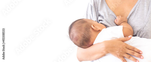 mother breastfeeding and hugging baby. Young mom breast feeding her newborn child. Baby eating milk before he sleeping. Milk from mom’s breast is a natural medicine for children  Mother day 