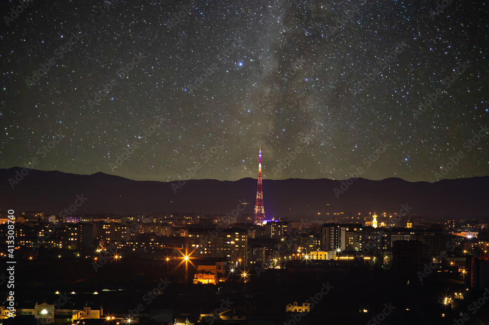 TV tower in the Ukrainian city against the background of the starry sky